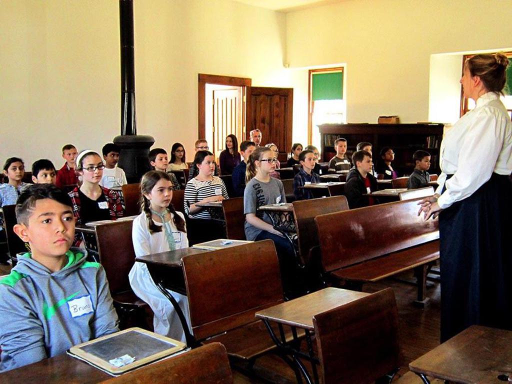Students on a field trip learn about life in one-room schoolhouse at Lanesfield School. [source](https://www.jcprd.com/435/Lanesfield-Historic-Site)