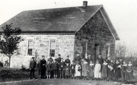 An undated photo of students and teachers outside the Lanesfield School. [source](https://www.flickr.com/photos/jocomuseum/5081160045)
